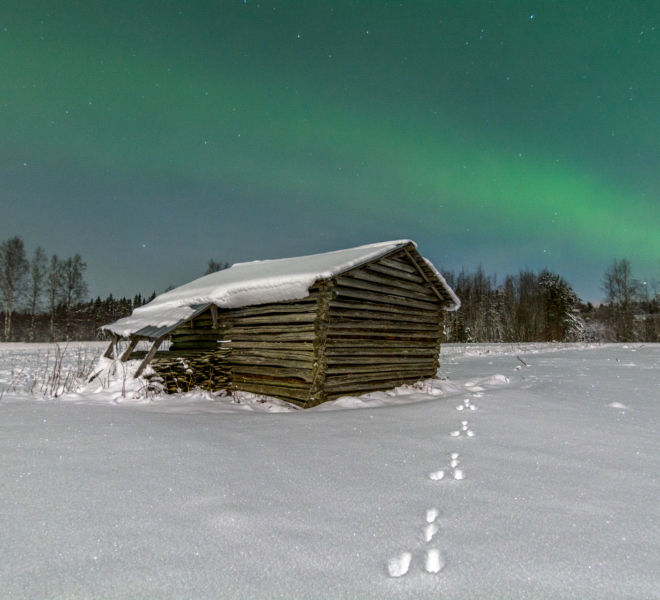 Snow barn with beautiful auroras
